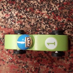 Green Mud Pie wooden pull toy car